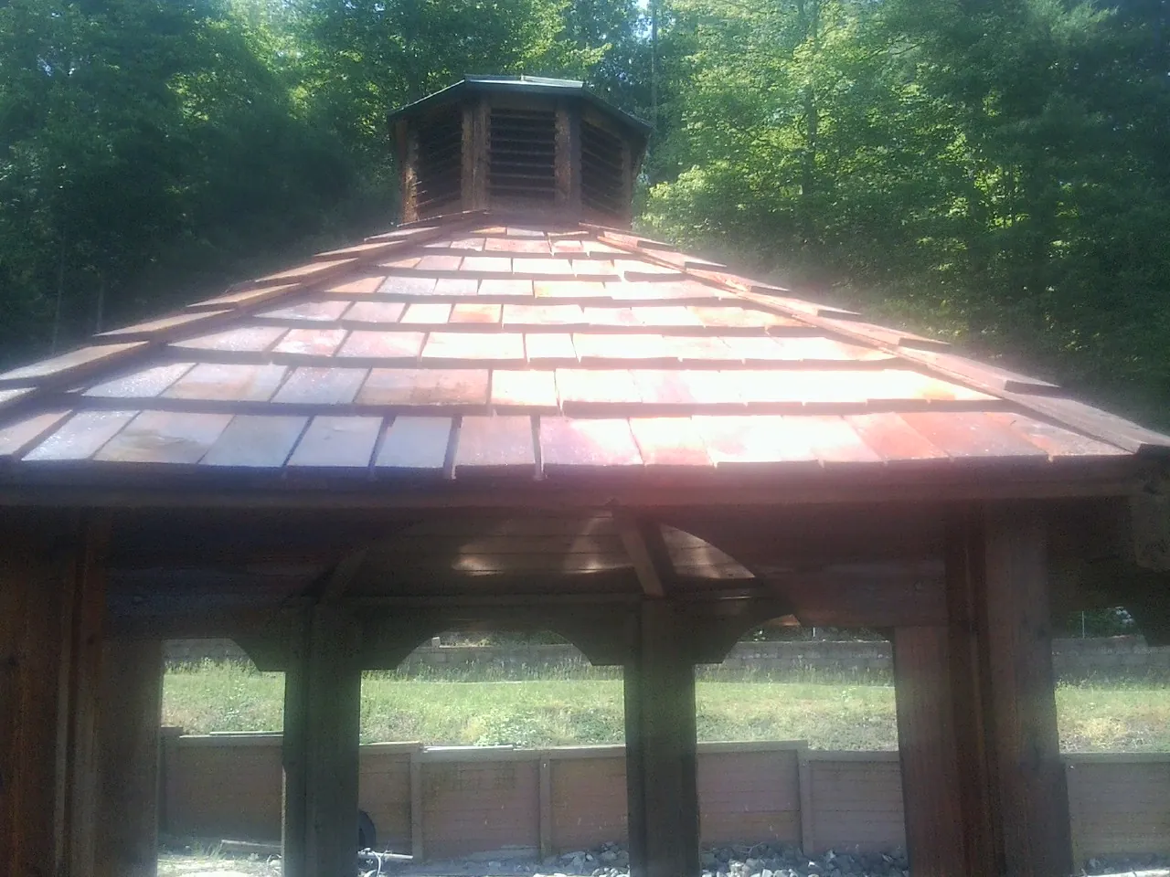 New cedar shake roof and cupola on a lakeside gazebo in Burnsville